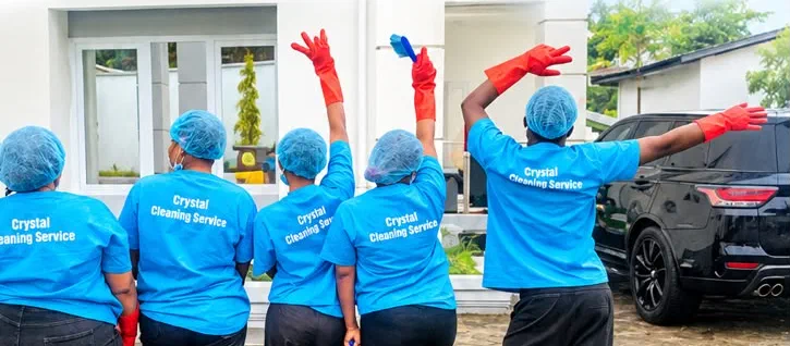 The Crystal Cleaning Service team in Buea in their blue uniforms, hair nets and red gloves